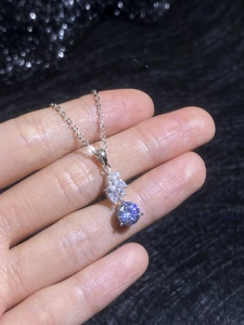 Close-up of S925 silver necklace with marquise moissanite and round pearl cluster