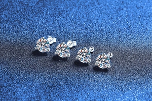 Macro detail of 925 sterling silver moissanite earrings with 3-prong martini setting