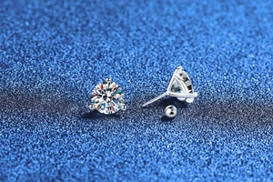 Macro view of S925 sterling silver three-prong Moissanite stud with screw back closure