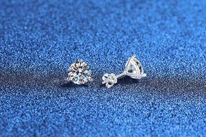 Macro shot of S925 sterling silver moissanite stud earrings with classic 3-prong setting