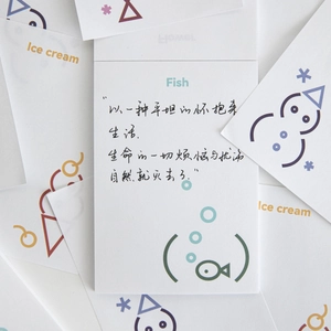 Minimalist paper memo pad with teal fish icon and artistic handwriting for journaling