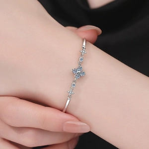 Elegant S925 sterling silver clover and star bracelet with sparkling zircon on wrist