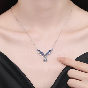 Elegant S925 sterling silver necklace with a V-shaped blue gemstone and moissanite pendant