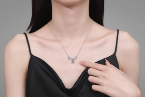 Close-up of S925 silver necklace with 1 carat blue moissanite and antler design