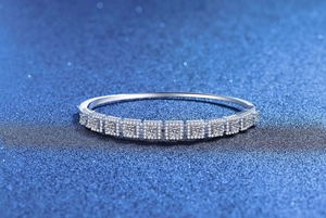Detailed view of S925 sterling silver bangle with square moissanite stones and starry halo