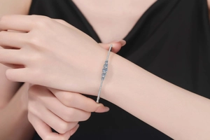 Close-up of elegant 1.3ct moissanite sterling silver bracelet worn on a female wrist