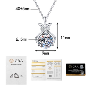 Macro detail of silver lucky bag pendant with size specs and GRA certification card