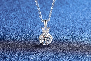 Macro view of S925 sterling silver lucky bag pendant with 1ct moissanite diamond