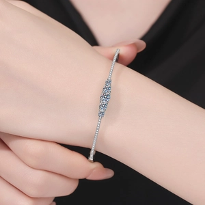 Minimalist s925 silver bracelet featuring three round moissanite stones and pave diamonds