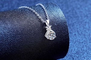 Macro shot of S925 silver lucky bag pendant with sparkling 1ct moissanite gemstone