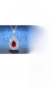 Detail of tear-drop pear cut necklaces with ruby and sapphire gems in 925 silver