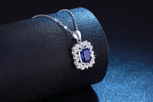 Macro shot of S925 sterling silver necklace with rectangle blue gemstone and white zircons