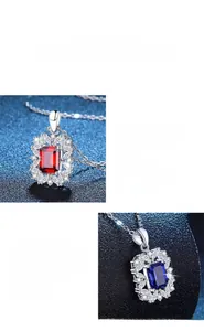 Detailed close-up of emerald-cut red and blue gemstone pendants with fine silver plating