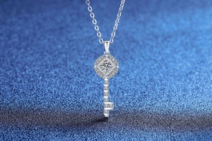 Macro shot of S925 sterling silver key necklace with brilliant moissanite stone