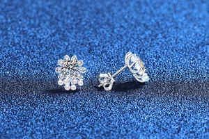 Detail of S925 silver sunflower moissanite earrings with dangling white pearls