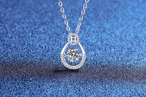 Macro shot of S925 sterling silver waterdrop pendant with dancing Moissanite stone