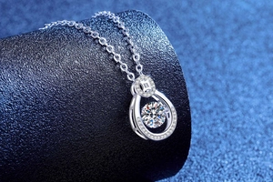 Macro shot of S925 sterling silver waterdrop pendant with a sparkling moissanite stone
