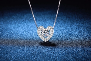 Macro view of heart-shaped 925 silver necklace with sparkling 1 carat moissanite gemstone