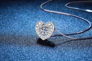 Macro view of heart-shaped 925 sterling silver necklace with sparkling moissanite stone