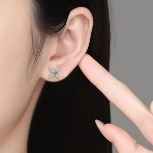 S925 sterling silver X-shaped moissanite stud earrings featuring cross design on ear