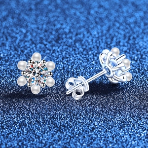 Elegant S925 sterling silver snowflake earrings with moissanite and pearls on blue base
