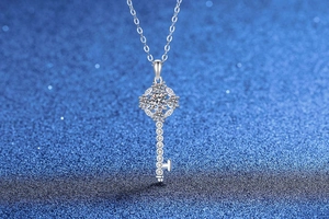 Macro shot of S925 silver sunflower key pendant necklace with sparkling moissanite stones