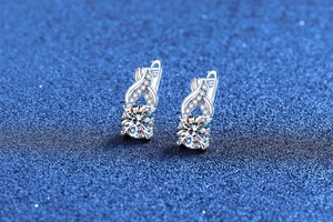 Macro shot of S925 sterling silver moissanite earrings with infinity twist design