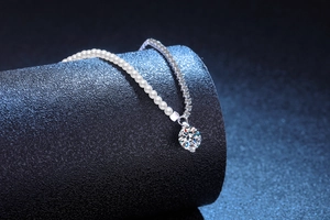 Detailed close-up of S925 silver moissanite necklace with pearls on a luxury background