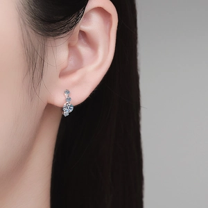 Elegant S925 sterling silver earrings with three graduated round moissanite stones