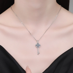 Elegant S925 sterling silver sunflower key necklace with moissanite pendant on model