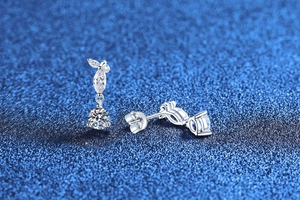 Detailed close-up of S925 silver tassel earrings with pear-cut cubic zirconia crystals