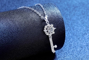 Macro detail of S925 silver star key pendant with a sparkling 1ct moissanite center