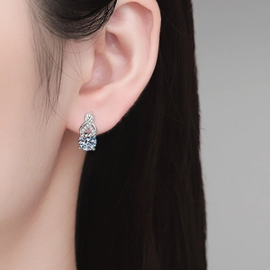 Elegant S925 sterling silver moissanite earrings with infinity cross design on model
