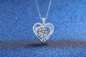 Macro shot of 925 silver heart pendant featuring a 3-carat moissanite with multi-layer halo