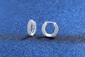 Macro shot of S925 sterling silver hoop earrings with shimmering moissanite pave setting