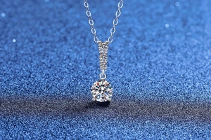 Macro view of S925 sterling silver necklace with sparkling moissanite cluster pendant