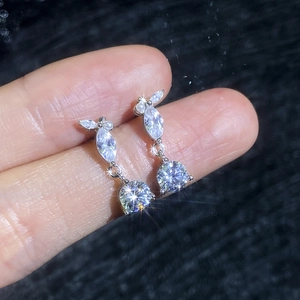 Elegant moissanite stud earrings featuring water drop tassels and small white pearls
