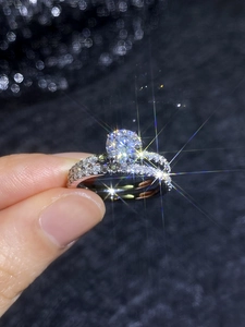Close-up of S925 sterling silver moissanite double ring set with classic six-prong setting