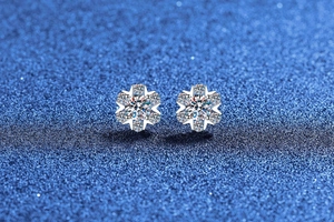 Macro detail of S925 sterling silver moissanite stud earrings in snowflake design