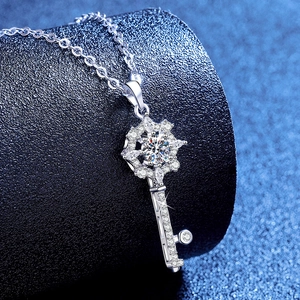 Elegant S925 sterling silver star-key necklace with 1-carat moissanite on dark blue base