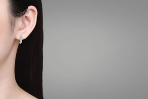 Detailed view of S925 sterling silver hoop earrings with pavé set moissanite stones