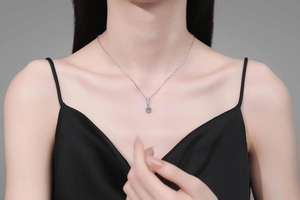 Close-up of S925 sterling silver moissanite necklace worn on model neck for elegance