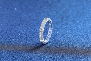 Detailed macro view of S925 sterling silver ring featuring pave set moissanite stones
