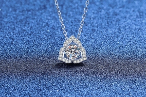 Macro shot of S925 silver flower necklace with Moissanite stone and halo setting