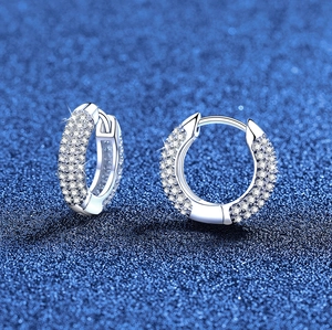 Sparkling S925 sterling silver hoop earrings with full pave moissanite on blue background