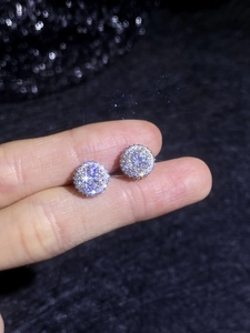 Close-up of S925 sterling silver halo stud earrings with brilliant moissanite center stone