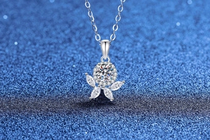 Macro detail of S925 sterling silver flower pendant necklace with brilliant moissanite stone