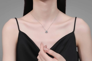 Detailed close-up of a Moissanite flower pendant necklace on a silver S925 chain