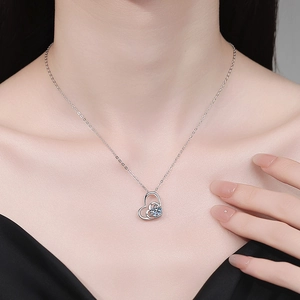 Elegant S925 sterling silver double heart pendant necklace featuring a brilliant moissanite stone