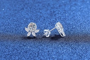 Close-up of S925 sterling silver flower earrings with brilliant moissanite stones